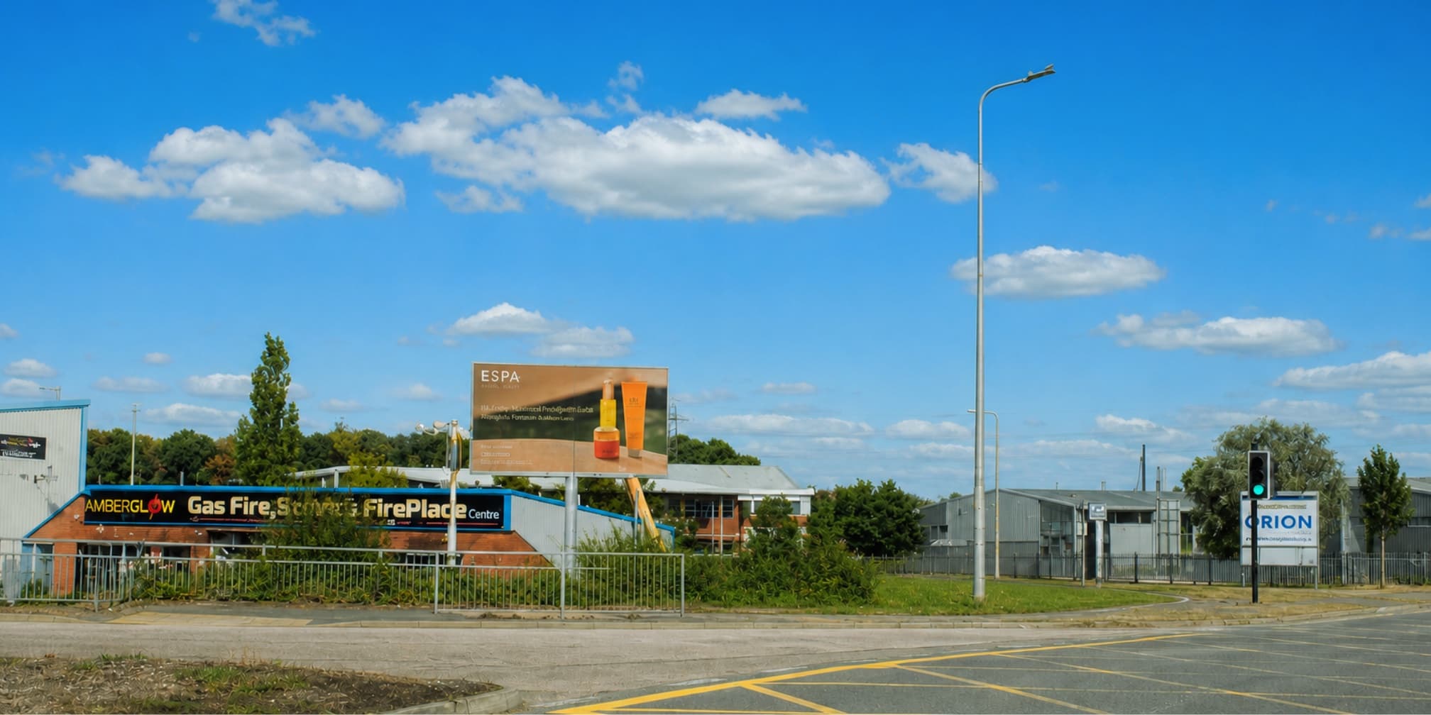 The Totally Charged billboard on the Cheshire Oaks roundabout, seen from the approach road
